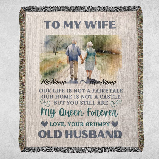  Heirloom Artwork Woven Blanket sentimental message is brought to life with an elegant image of an elderly couple walking hand in hand, symbolizing a lifelong journey of love and devotion. The blanket is displayed on a light marble gray background.